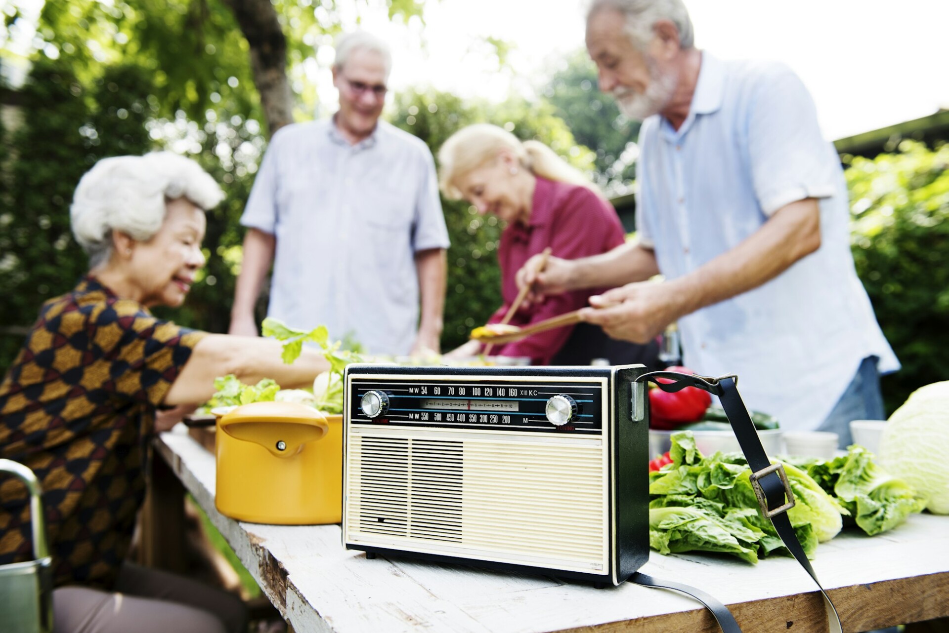 Closeup of retro classic radio on wooden cooking table