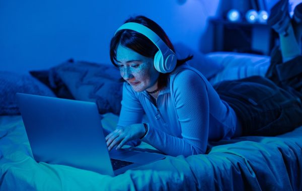 Teenage girl using laptop for online communication